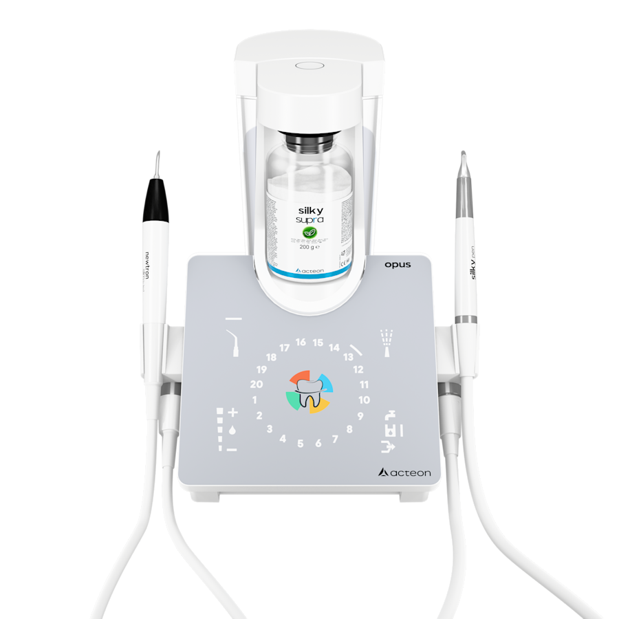 OPUS unit combining an air polisher and an ultrasonic scaler, with its two handpieces docked